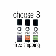 Lip balm tubes with black caps, white labels, and MADE IN THE SHADY text, three flavor options shown
