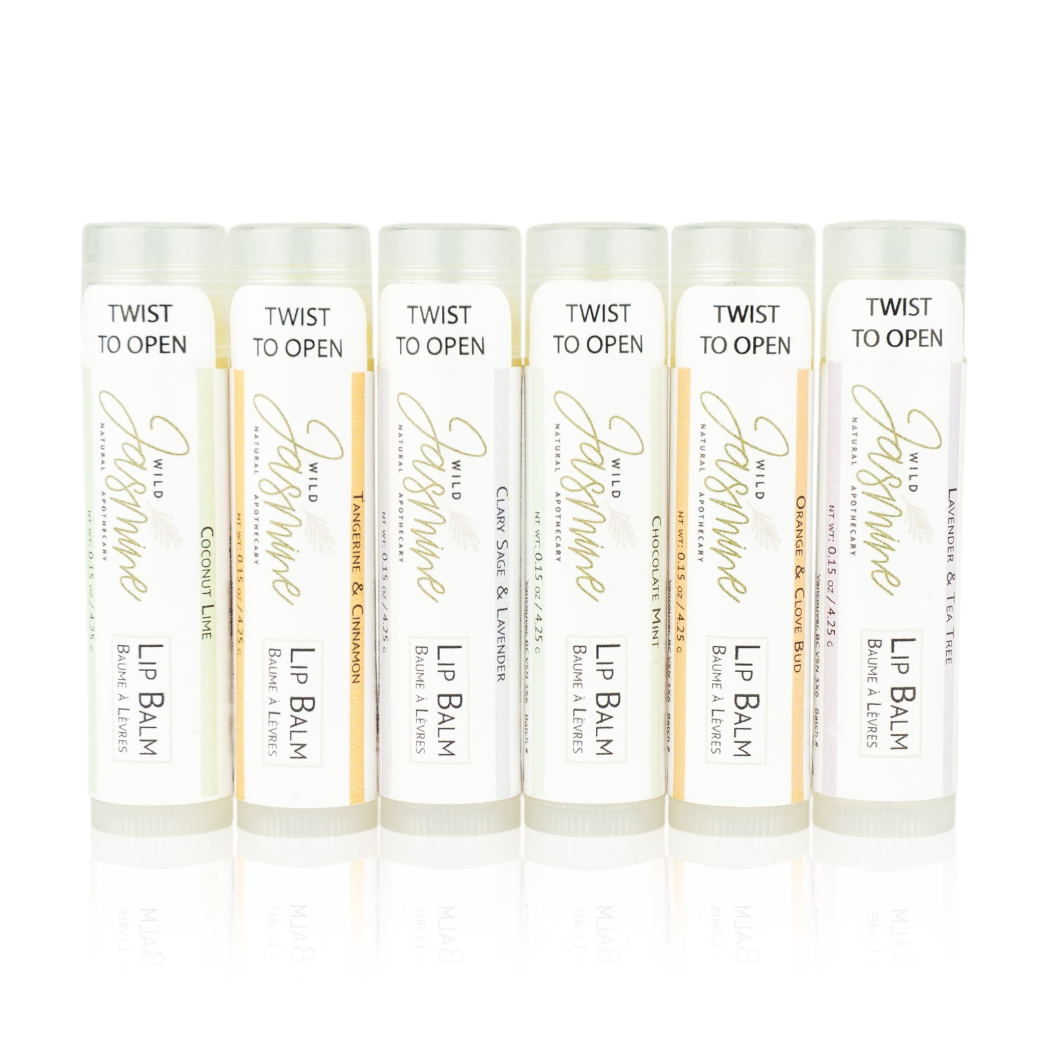 Lip balm tubes with white, gold, and colored labels, Wild Jasmine brand, for lip care