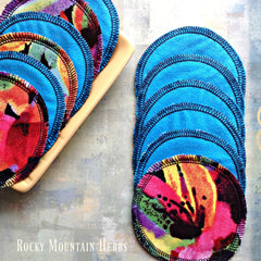 Reusable facial rounds, blue fabric with black stitching and colorful floral pattern, Rocky Mountain Herbs brand