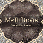 Eye shadow with dark brown color and silver sparkle, Mellifluous brand name included