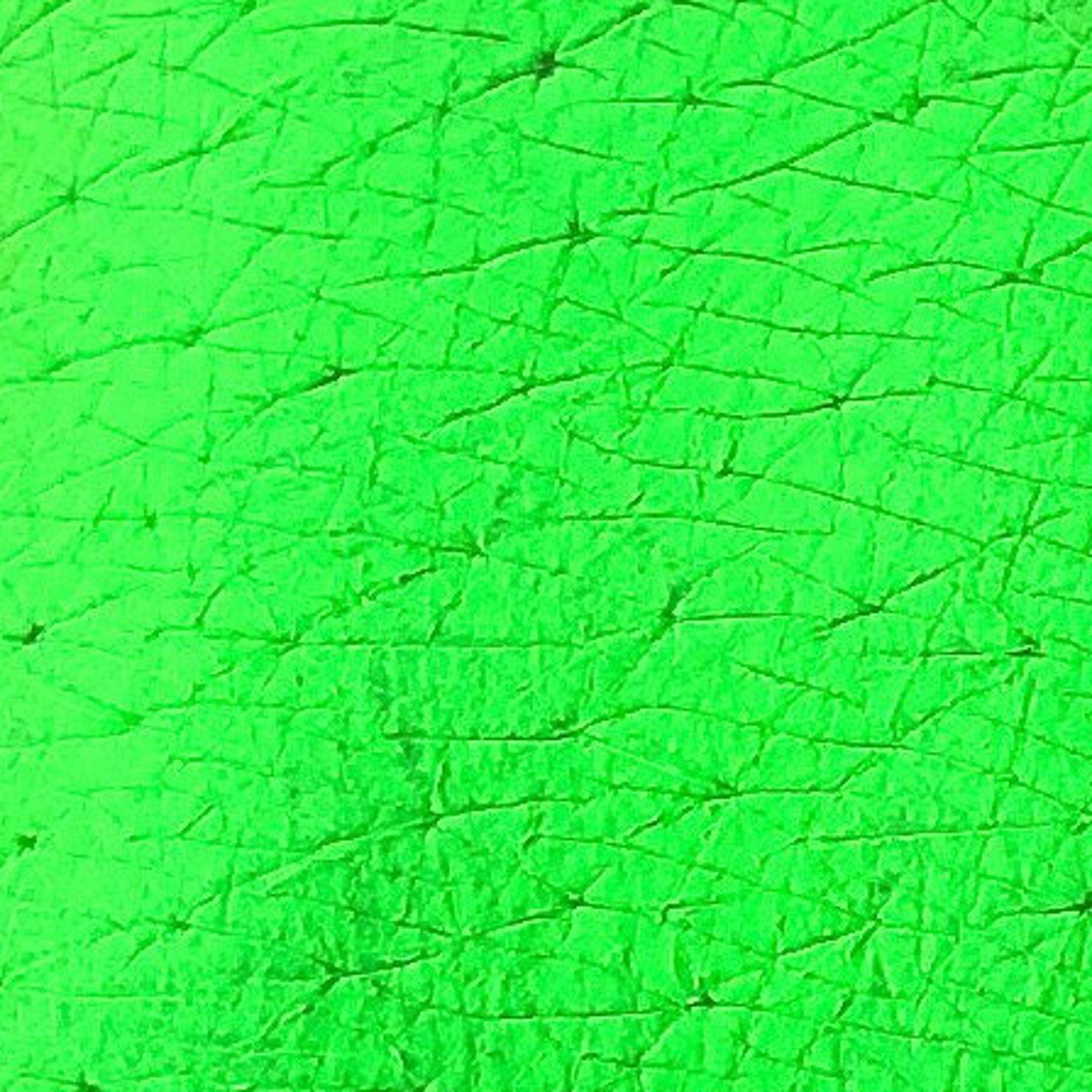 Eye shadow pigment, neon green, textured surface, cracked pattern