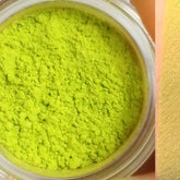 Close-up of vibrant lime green eyeshadow pan with smooth matte finish in sleek black compact