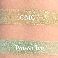 Close-up of vibrant lime green eyeshadow being applied to eyelid with fluffy makeup brush