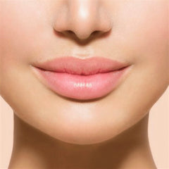 Lips with pink color and smooth texture, close-up view of face