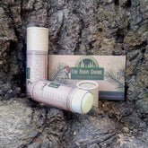 Lip balm tubes with beige and white packaging, "Lip Service" text, and The HAIRY GNOME brand