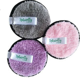 Makeup removers, three round pads in gray, pink, and purple with black trim, Naturally Lady brand