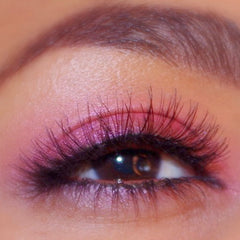 Side view of Rockstar vegan eyeshadow palette showing rich metallic purple and silver shades in compact case