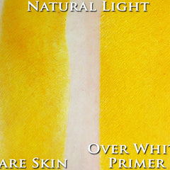 Yellow skin swatch with white primer test, showing color comparison, with text "OVER WHITE PRIMER