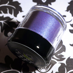 Dark purple loose pigment eyeshadow with metallic indigo shift and sparkling glitter, vegan mineral formula