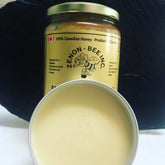 Skin care cream in a jar and tin, yellow color, with Zenon Bee Inc label visible