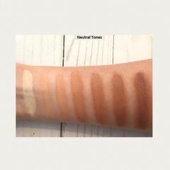 Foundation swatches in various neutral shades on arm for color comparison