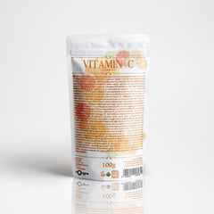 Close-up of golden yellow vitamin C serum with dropper, showcasing its smooth, luminous texture against natural light