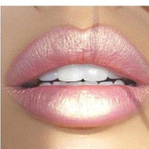 Lip balm with light pink color, glossy finish, and visible lip texture