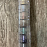 Mineral eyeshadow stack with clear plastic container and various colors visible