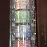 Mineral eyeshadow stack with clear plastic container, multiple colors, and layered design