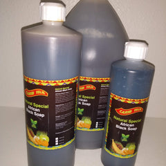 Close-up of amber liquid African black soap in a clear pump bottle with minimalist label, showcasing smooth texture