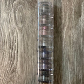 Mineral eyeshadow stack with clear plastic container, multiple colors, stacked vertically