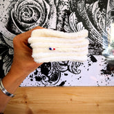 Stack of eco-friendly bamboo makeup remover wipes in soft green packaging with OEKO-TEX certification label