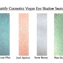 Eye shadow swatches with blue, peach, silver, and green colors from Attify Cosmetics
