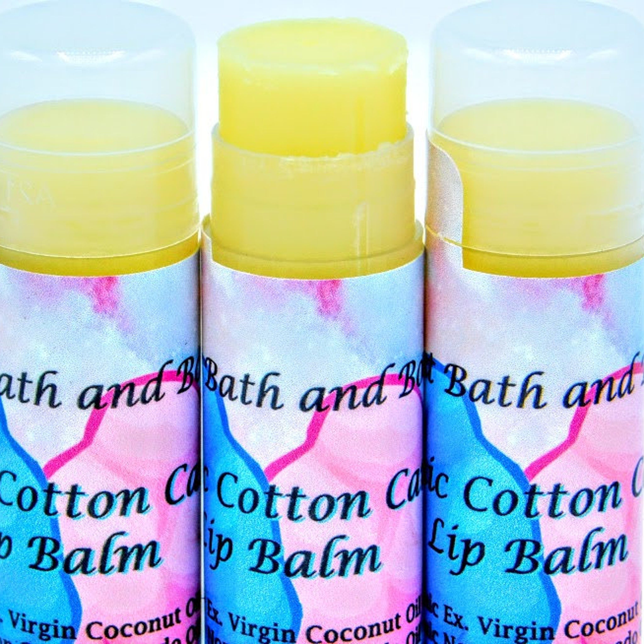Lip balm tubes with yellow balm, pastel pattern, and Ancient Bath and Body text