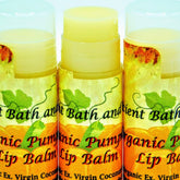 Lip balm tubes with yellow balm, clear caps, and Ancient Bath and Body label