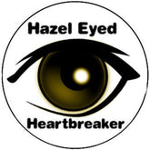 Stackable round eyeshadow palette with seven warm-toned shades for hazel eyes in matte and shimmer finishes