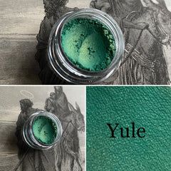 Shimmering green gold vegan mineral eyeshadow in compact with reflective gold packaging