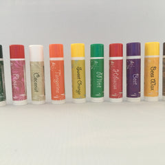 Lip balm tubes in various colors with flavor names printed on the labels