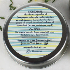 Tin with striped label, silver metal rim, and deepwellbotanicals.com text visible
