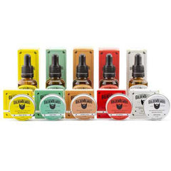 Hair oils and balms set with colorful boxes and Golden Beards branding, glass bottles, and round tins