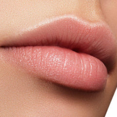 Lip balm application, close up of pink lips with smooth texture and subtle shine
