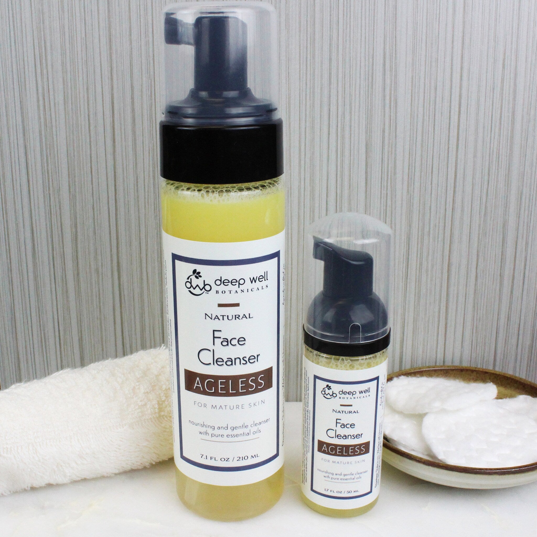 Foaming facial cleanser bottles, clear plastic and black pump, Deep Well Botanicals labels