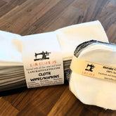 Facial cloth wipes, white and gray cloth with LanCraftUS branding, stacked and round