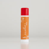 Tangerine lip balm, orange and red tube with white floral design, vertical presentation