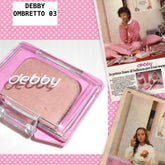 Eyeshadow compact with pink case, beige powder, and DEBBY logo in white lettering