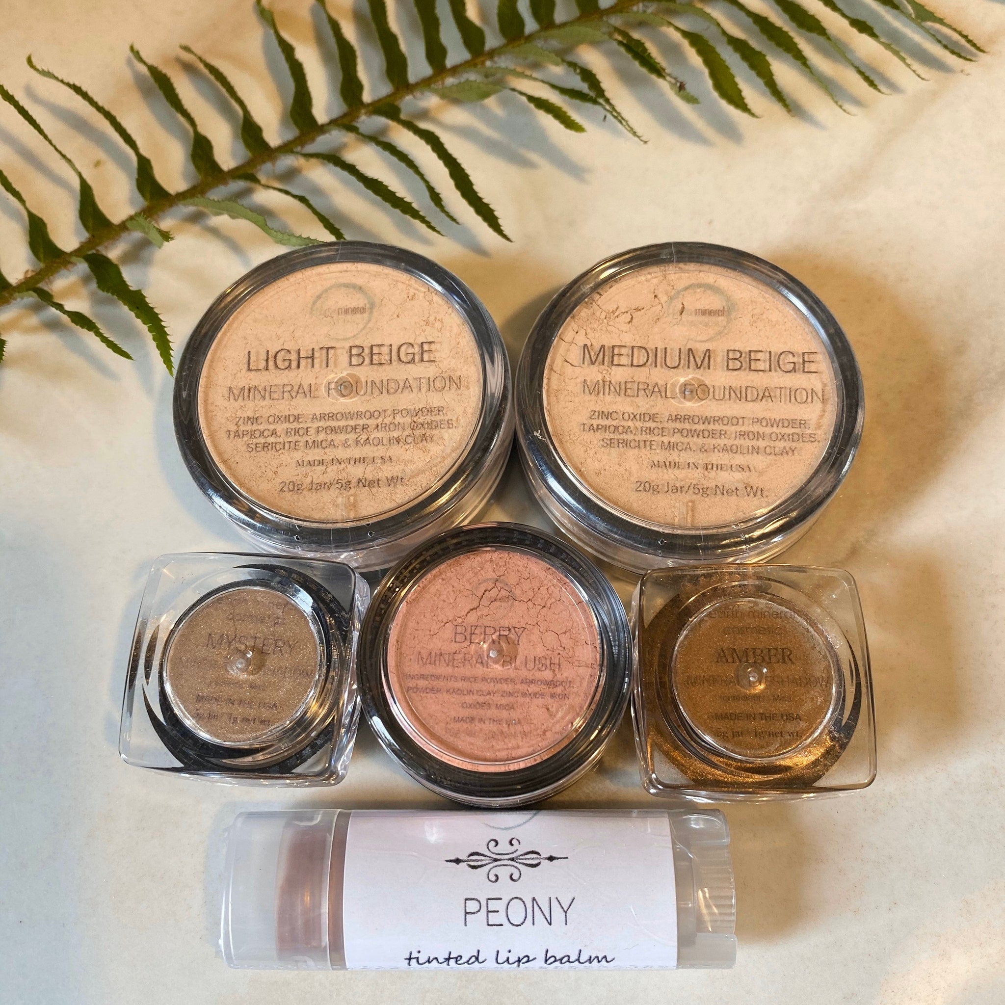 Mineral makeup set with beige powder, blush, and lip balm, Earth Mineral Cosmetics
