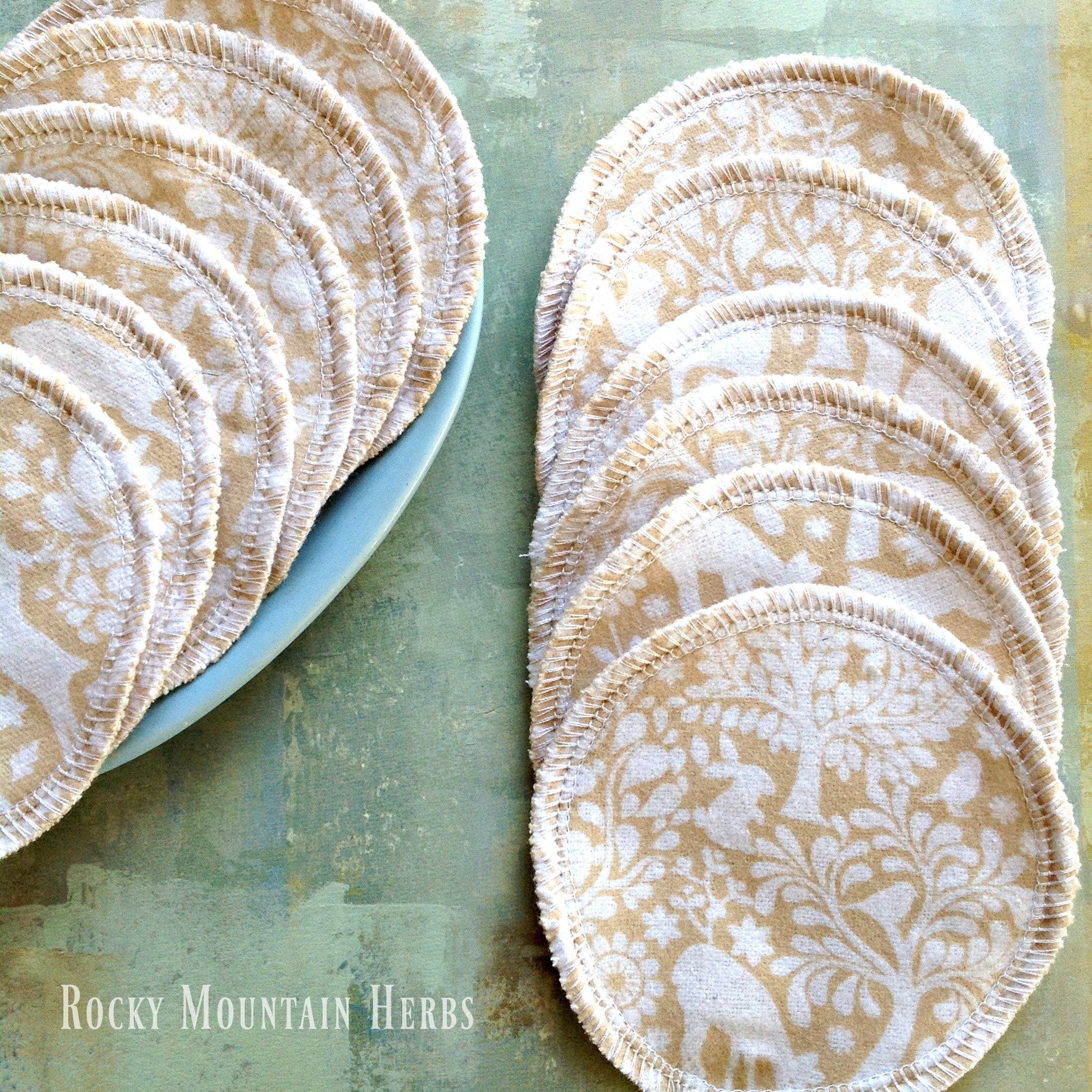Facial rounds, beige woodland print cotton, white stitched edge, Rocky Mountain Herbs brand