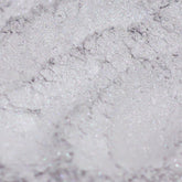Eyeshadow silver gray with lavender shimmer, close-up of textured powder