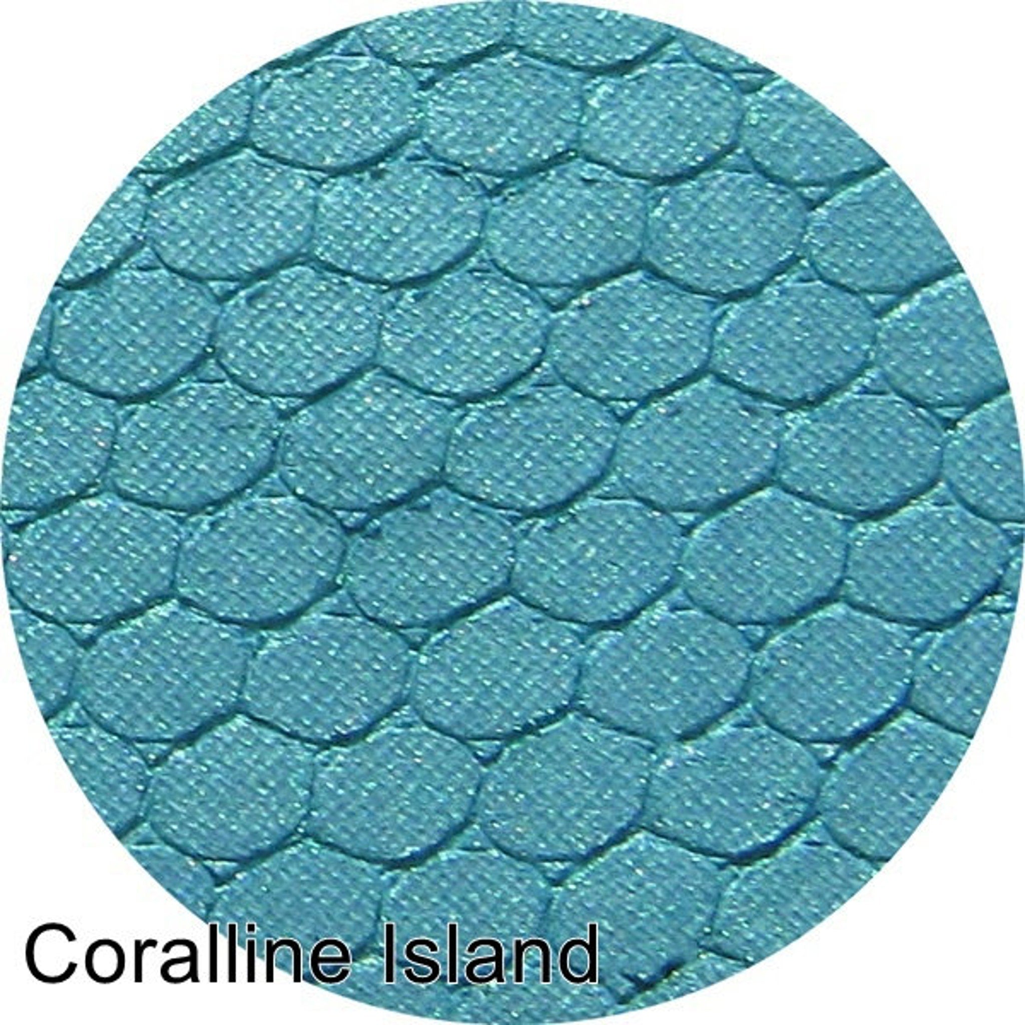Pressed eyeshadow, teal blue scale pattern, Coralline Island text visible