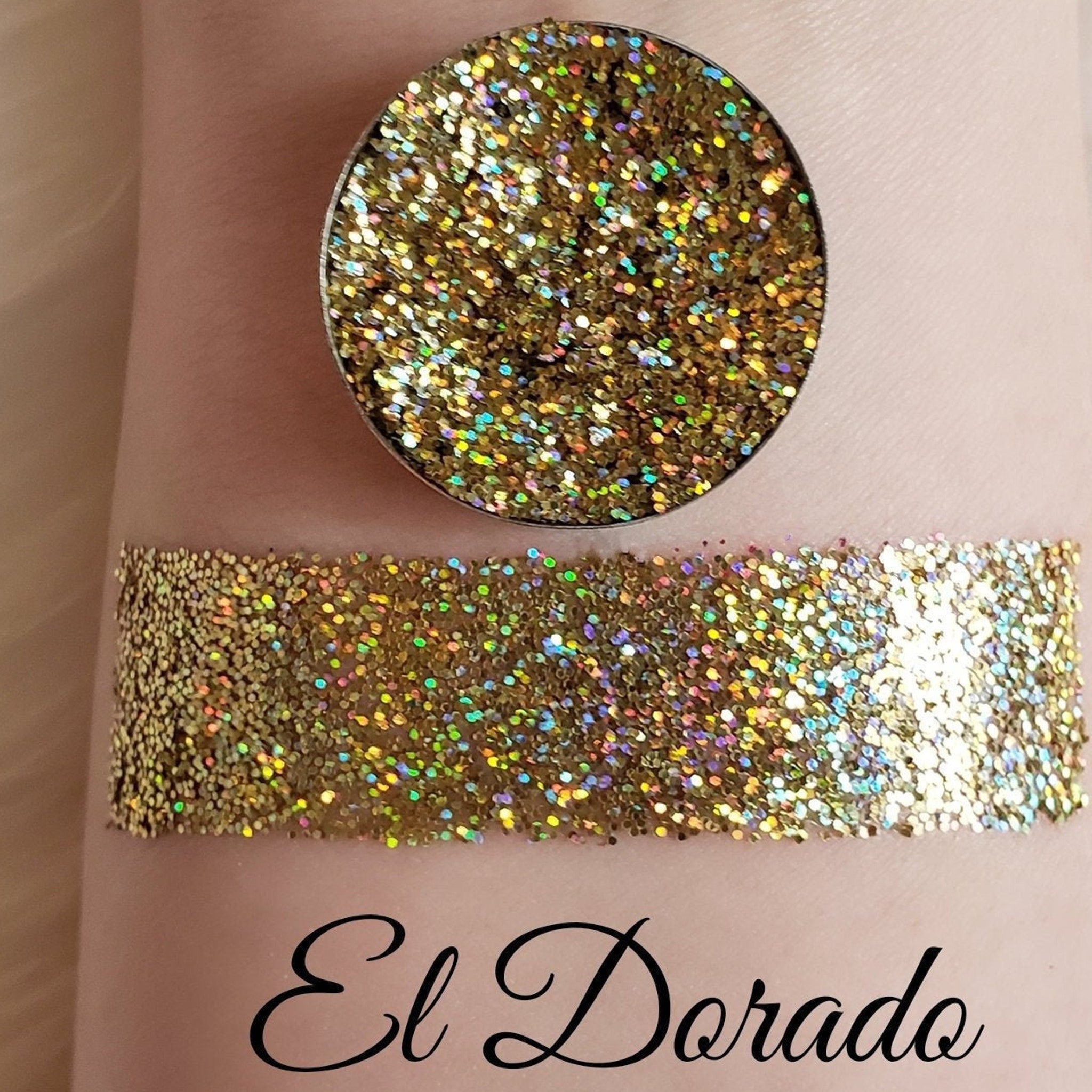 Glitter eyeshadow, gold glitter, pressed pan and swatch on skin, El Dorado text