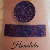 Glitter eyeshadow, dark purple glitter, swatched on skin, Honolulu text