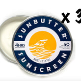 Sunscreen SPF 50 tin with blue and white label, SunButter brand visible, and cream contents