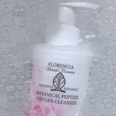 Facial cleanser bottle in white and pink with Florencia brand and bubbles around it