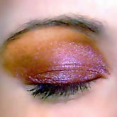 Cherry Sky Vegan Eye Shadow in a vibrant pink compact with mirrored lid and embossed logo