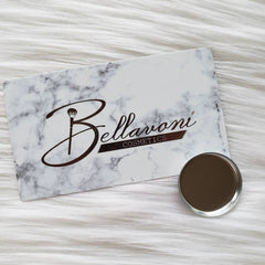 Bellavoni Cosmetics card with marble pattern, brown text, and silver compact on white fur background