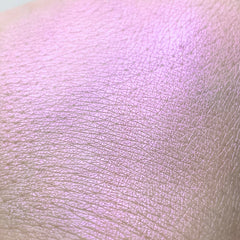 Skin texture with light pink and purple shimmer, close up view of skin