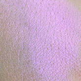 Eye shadow swatch, purple shimmer, skin texture, Tala product sample