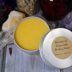 Healing salve in yellow, metal tin with label, Hayes Haven Apothecary text visible