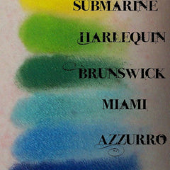 Swatch of eyeshadow, with yellow, green, teal, and blue shades, Spectrum brand name present