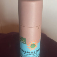 Sunmade Naturals container, pink and blue with text, cylindrical shape, all natural product label